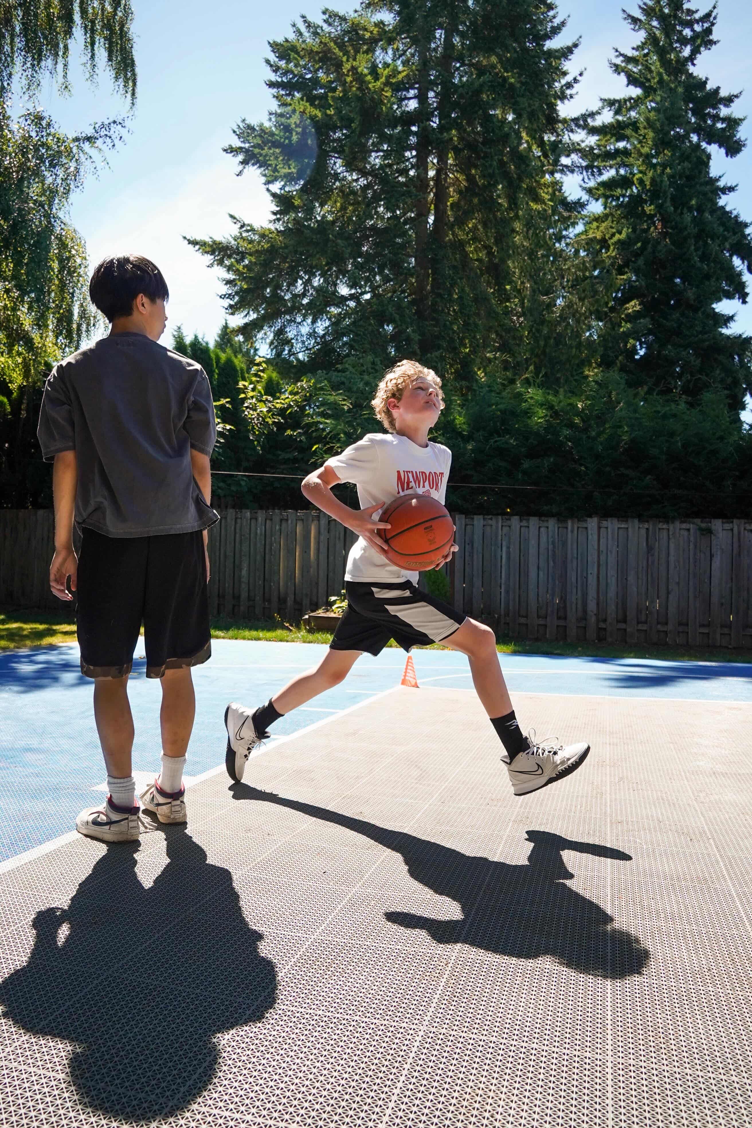Two players on an outdoor sport court